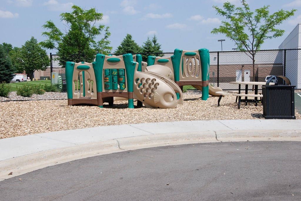 a playground with a large set of playground equipment