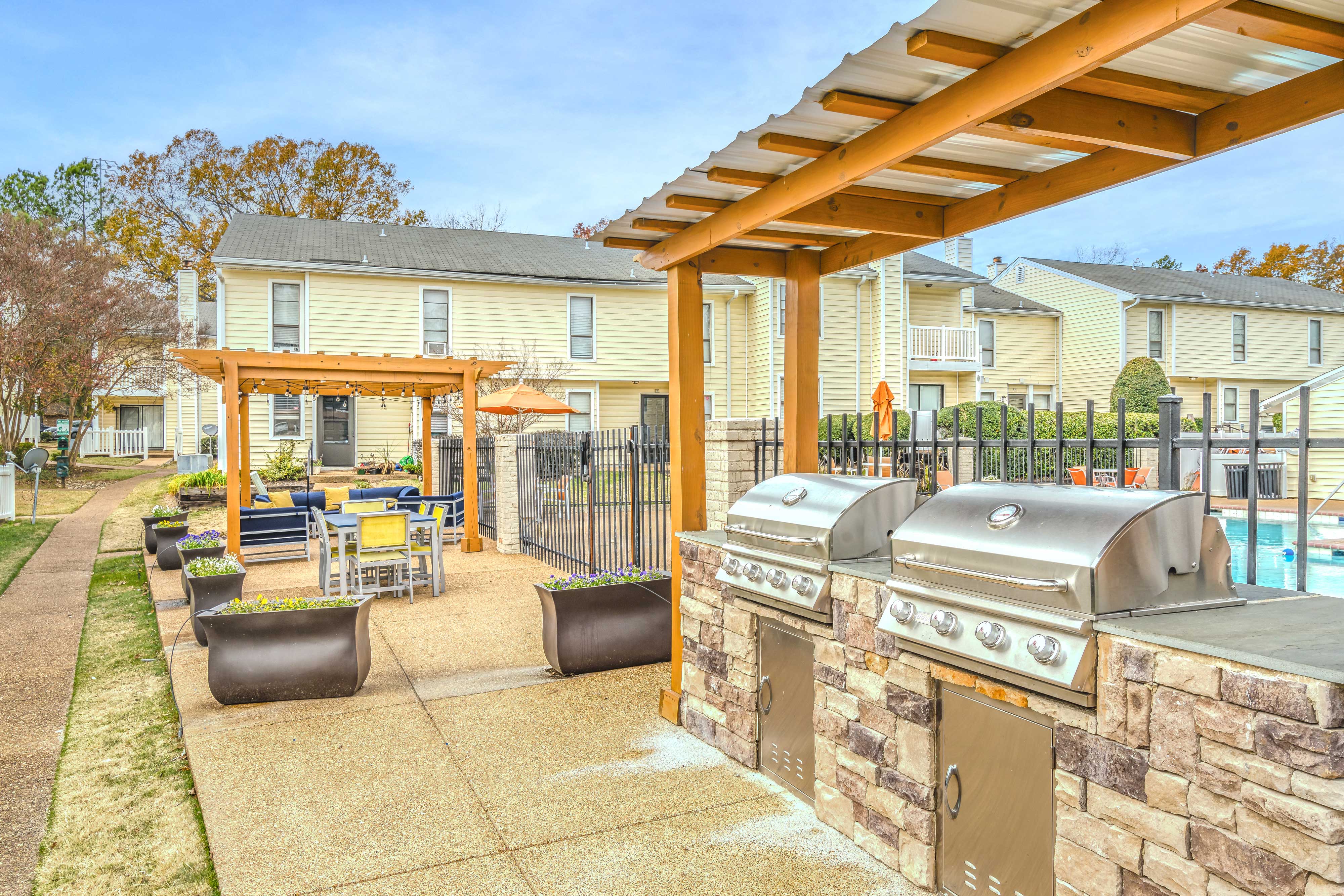 our outdoor kitchen and dining area is next to our swimming pool