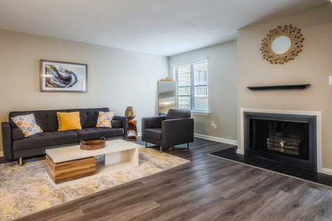 a living room with a fireplace and a couch