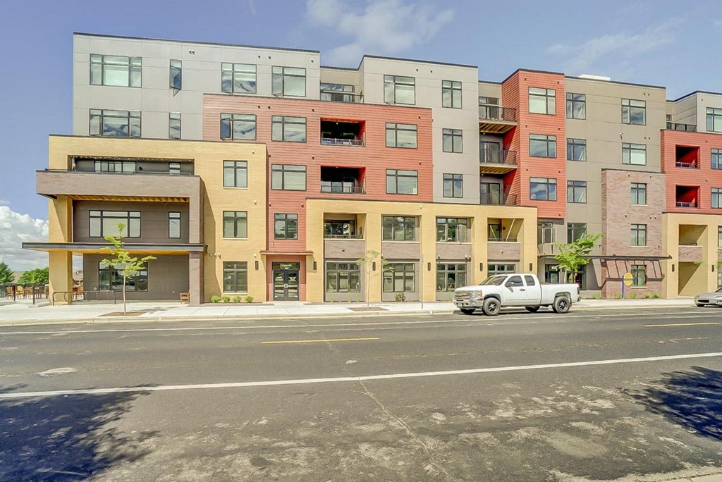 an image of an apartment building on a city street
