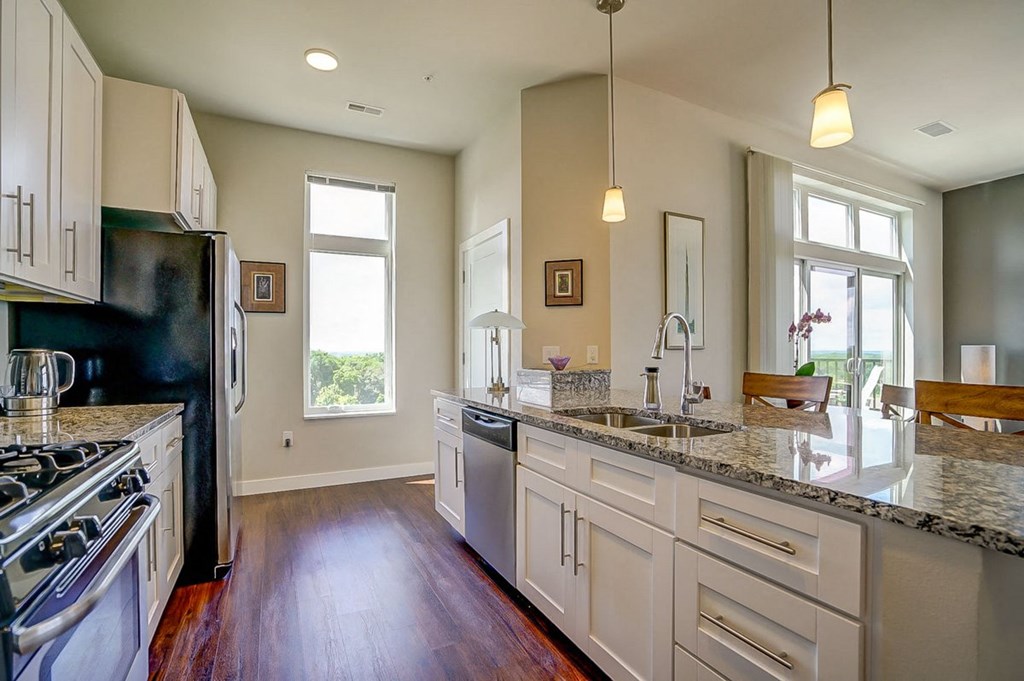 a kitchen with a counter top and a sink