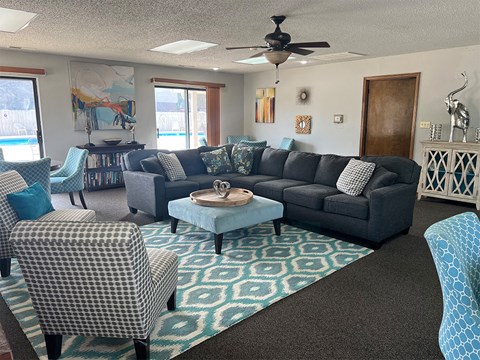 a living room with couches and chairs and a coffee table