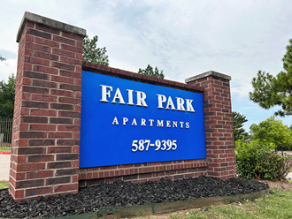 the sign for fair park apartments at fair park