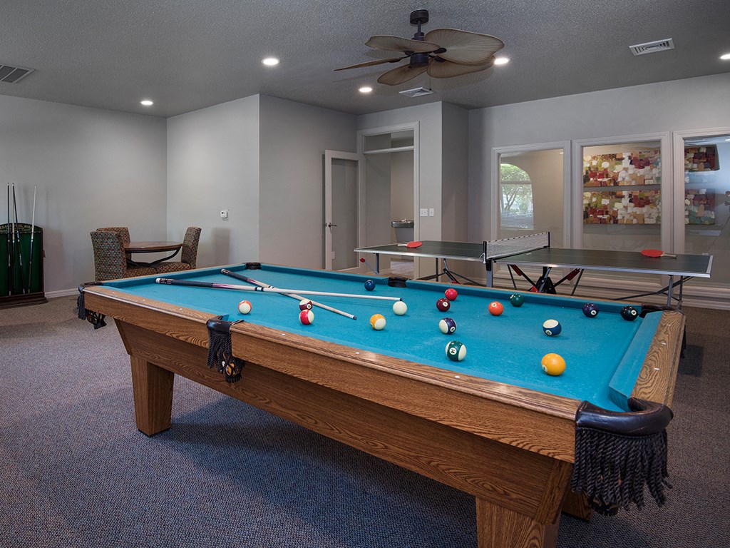 ?? billiards table in the clubhouse of a home with a pool