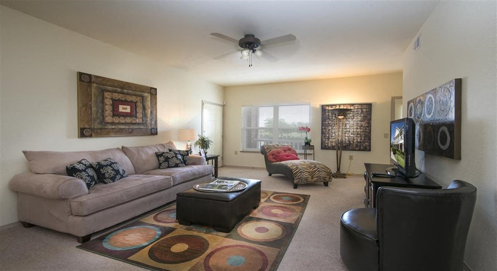 a living room with a couch and a tv