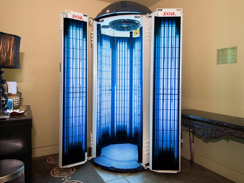 a pair of cages in a room with a blue screen door
