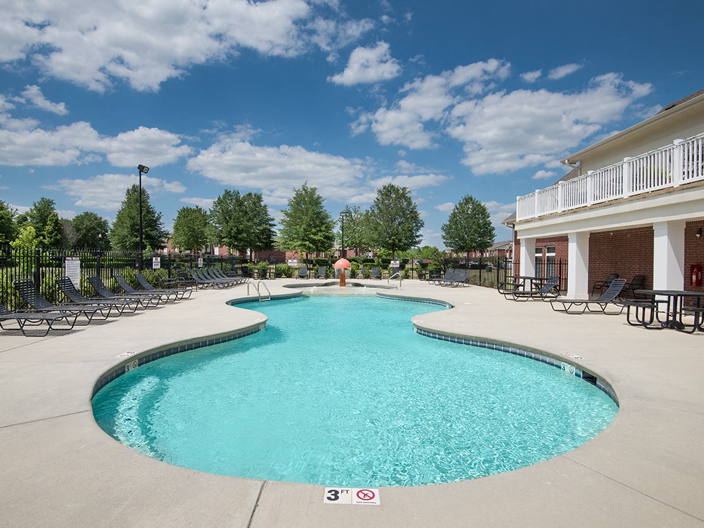 our resort style swimming pool is next to our building and has lounge chairs