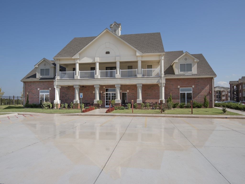 a large house with a large driveway in front of it