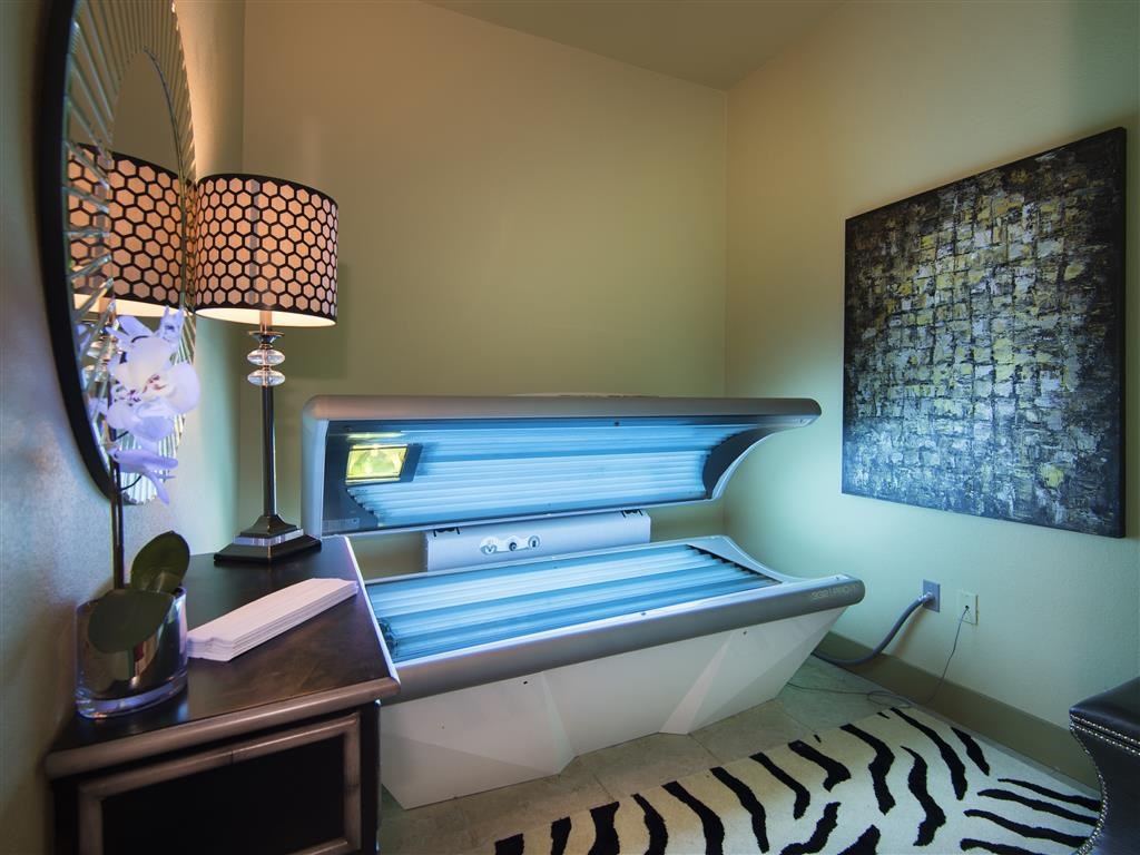 a spa room with a zebra rug and a bath tub