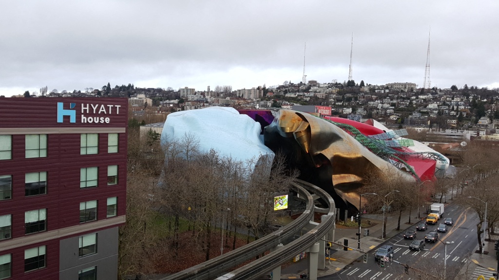 a large mural on the side of a building in a city