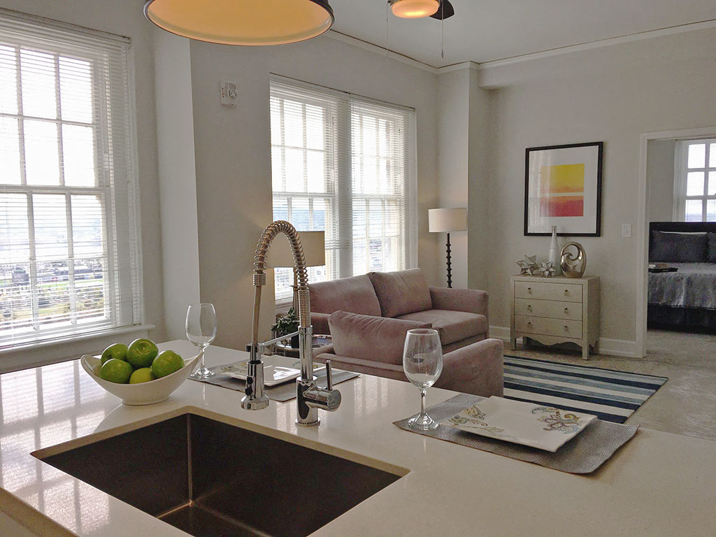 a living room with a couch and a sink