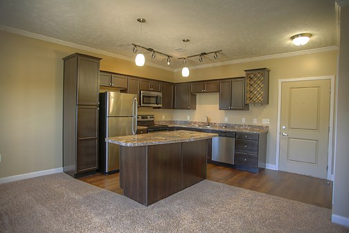 a kitchen with stainless steel appliances and granite counter tops