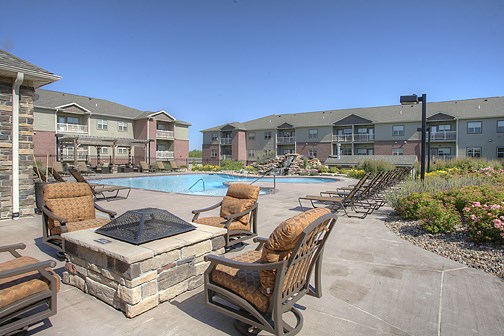 our apartments offer a pool and lounge area with chairs