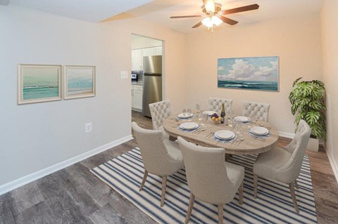 a dining room with a table and chairs