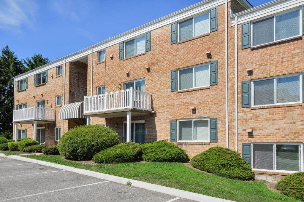 this is a photo of a brick apartment building with balconies