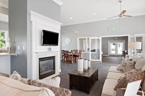 a living room with a fireplace and a couch