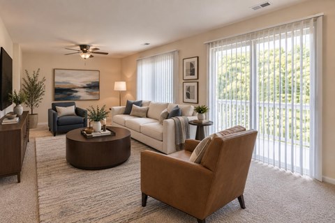 A living room with a brown chair and a white couch.