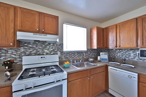 a kitchen with a stove and a sink