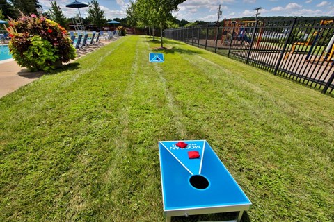 a game of pool on a table in the grass