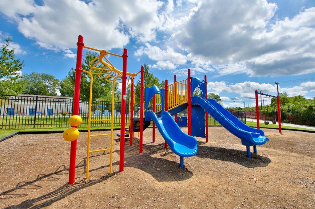a playground with slides at a park