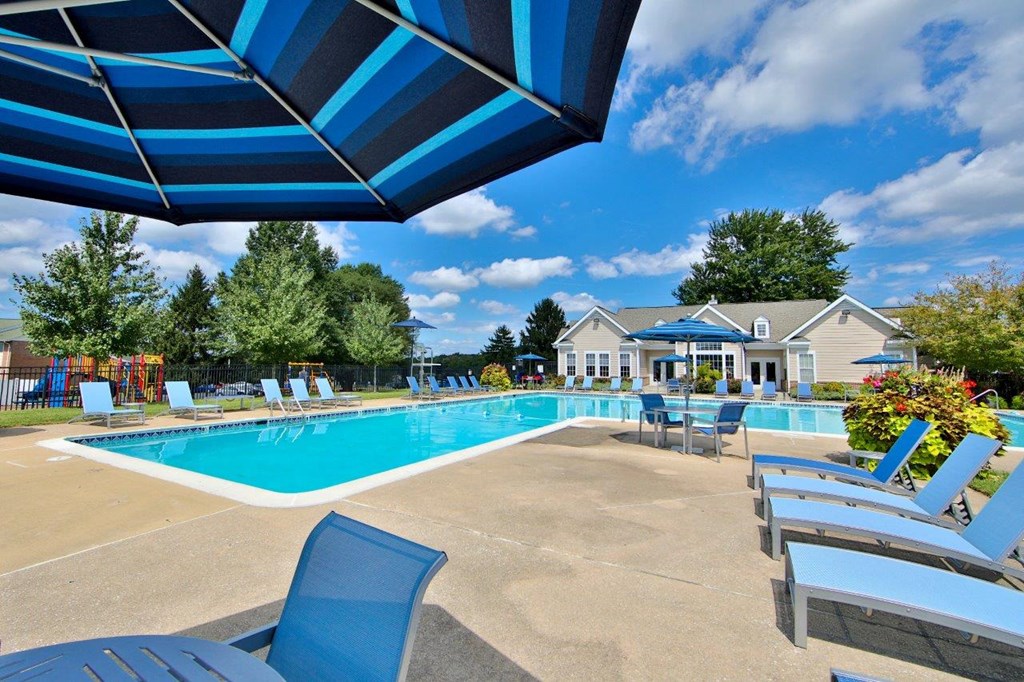 our apartments have a large pool and lounge chairs