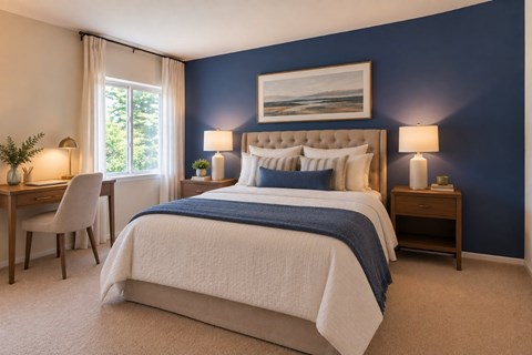 A bedroom with a large bed and a painting on the wall.