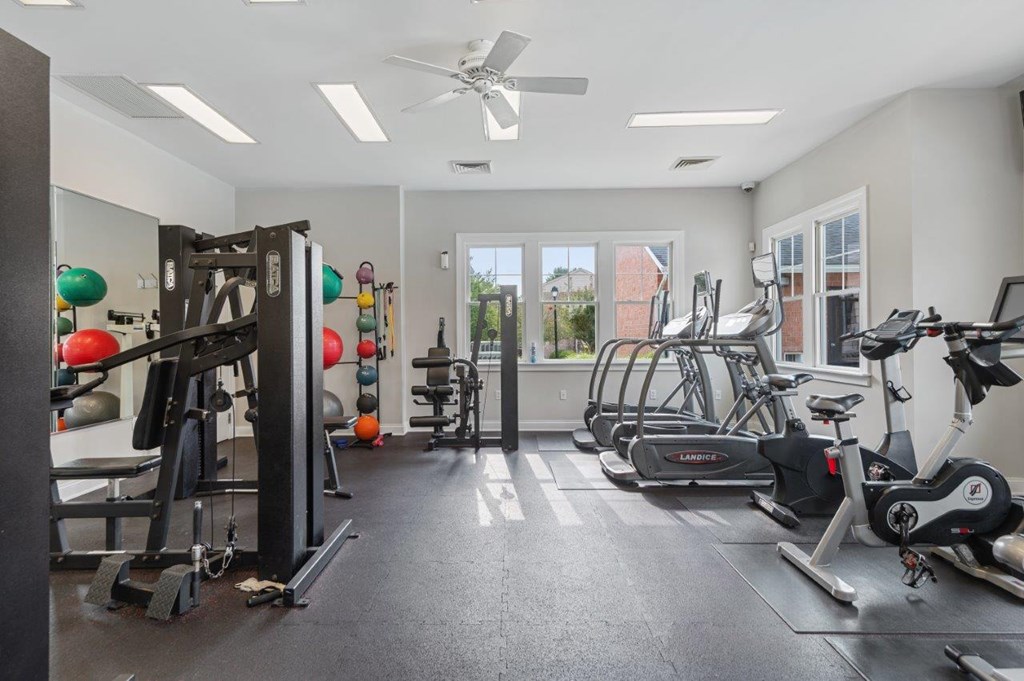 A spacious gym with a variety of exercise equipment.