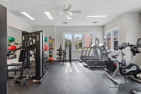 A spacious gym with a variety of exercise equipment.
