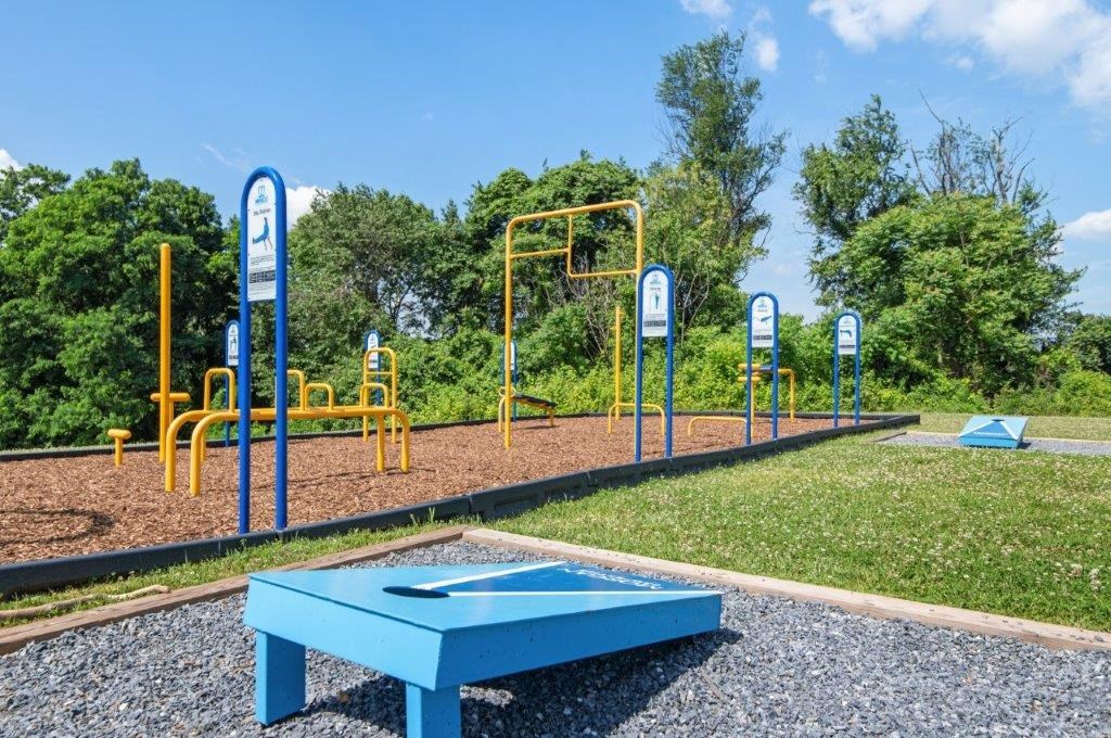 a playground and a blue table in a park