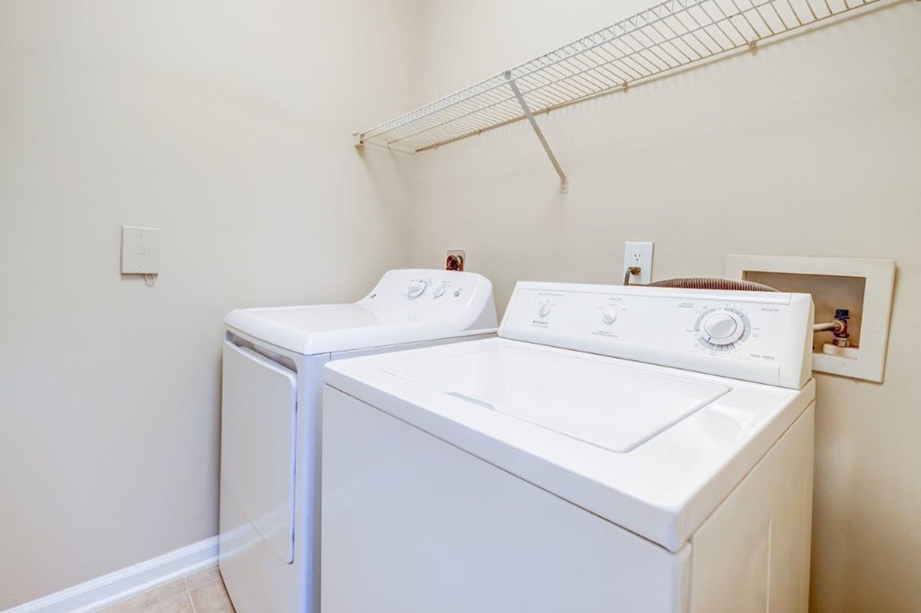 the washer and dryer in the laundry room of a home