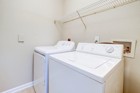 the washer and dryer in the laundry room of a home
