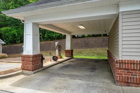 an empty garage with a fire hydrant on the side of a house