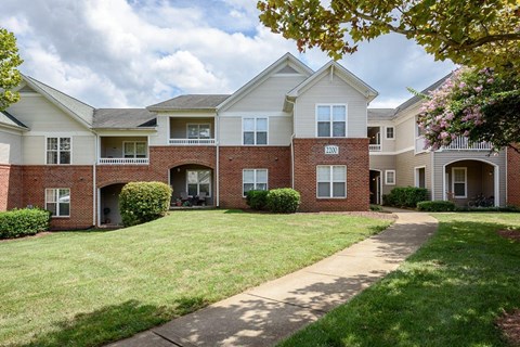 a brick and with a sidewalk in front of it