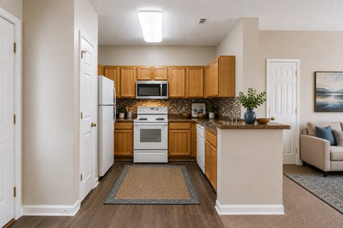 A kitchen with wooden cabinets and a white oven.