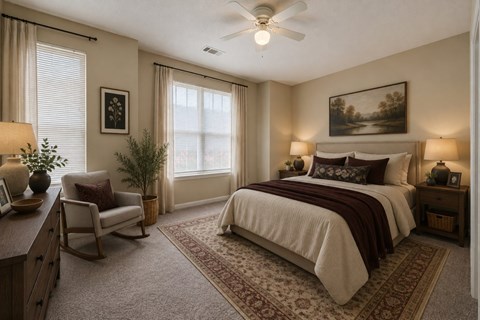 A bedroom with a bed, chair, and a painting on the wall.