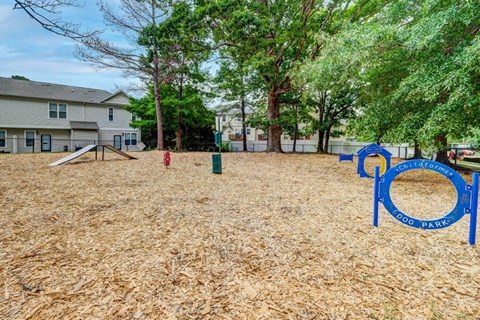A playground with a blue sign that says "Park" is in the foreground.