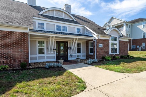 A house with a black roof and white trim.
