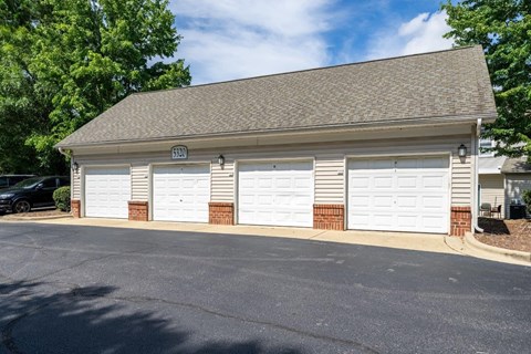 A two-car garage with a brick pillar on the left side.