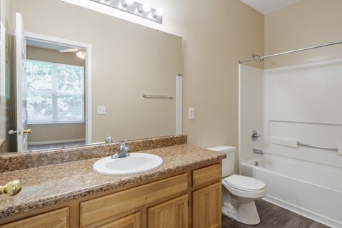 A bathroom with a white toilet and sink.