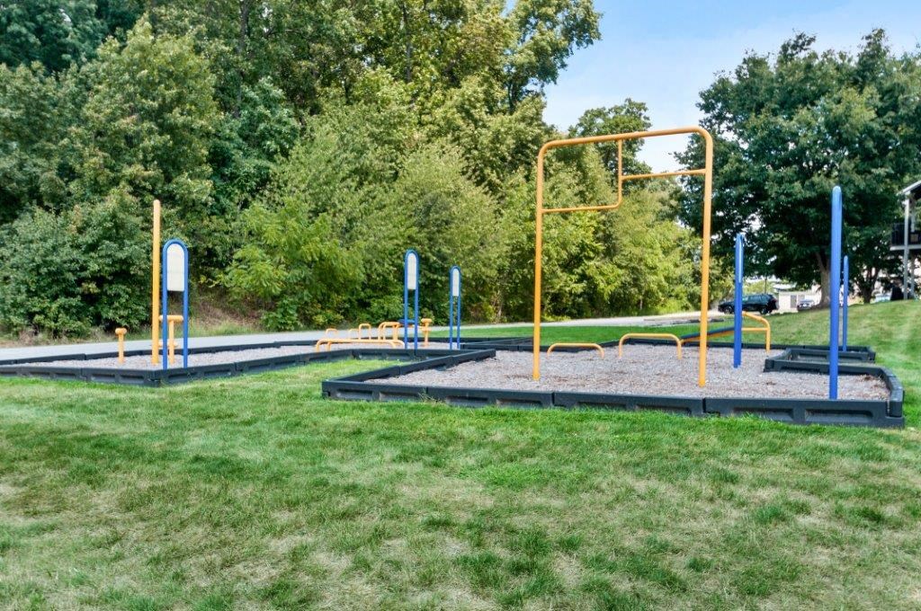 a playground in a park on a sunny day