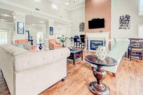 a living room filled with furniture and a fireplace