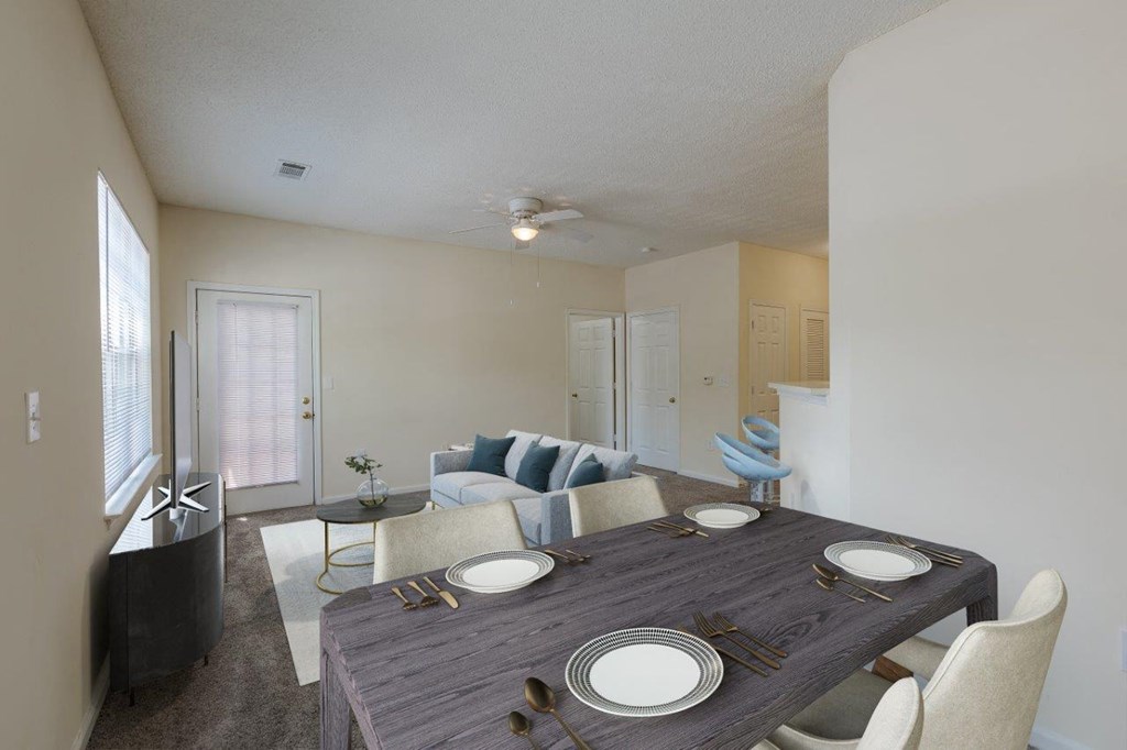 a dining room and living room with a table and chairs