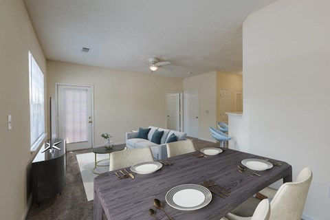 a dining room and living room with a table and chairs