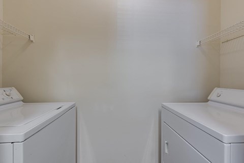 a laundry room with a washer and a dryer in it