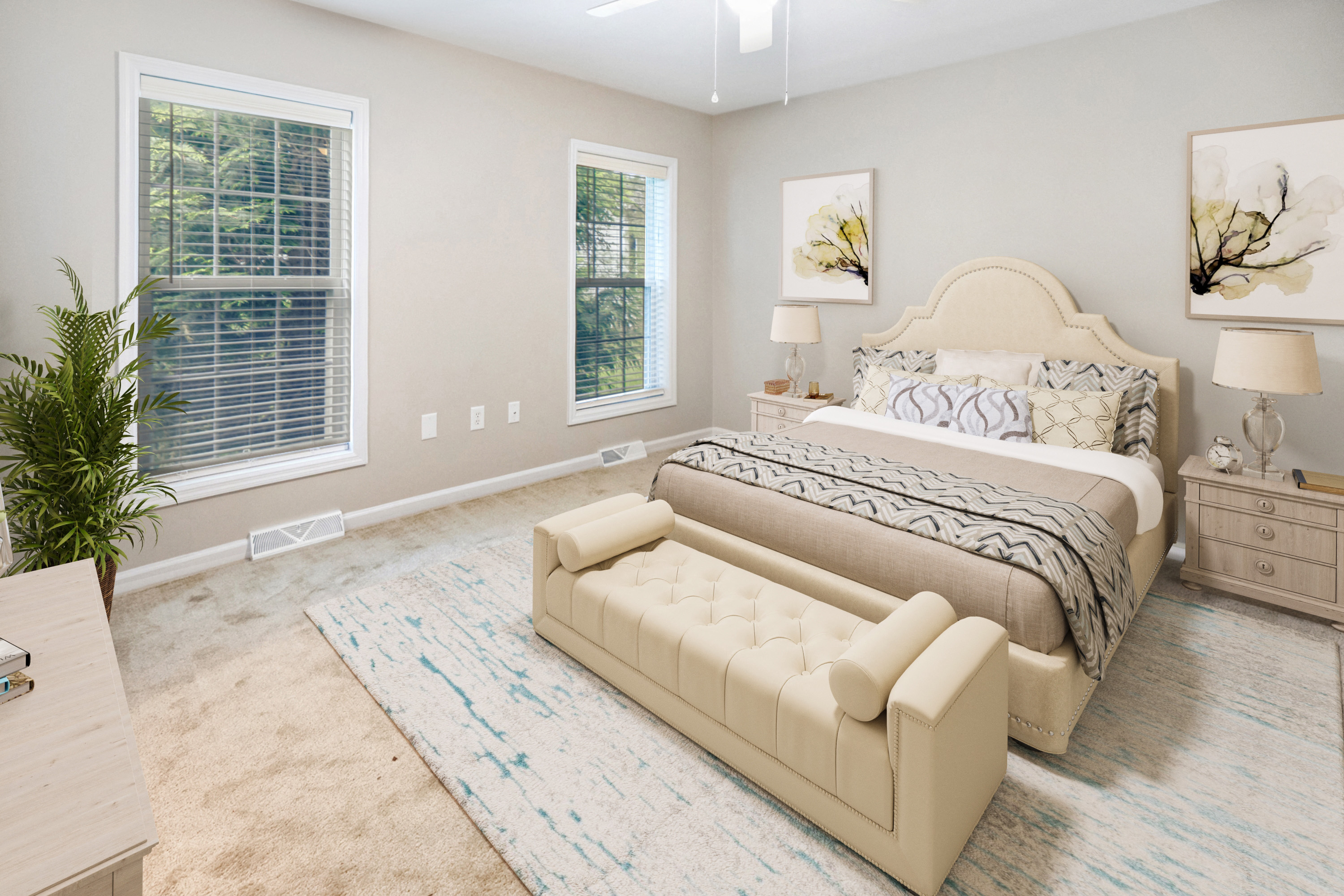 a bedroom with a bed and a couch and two windows