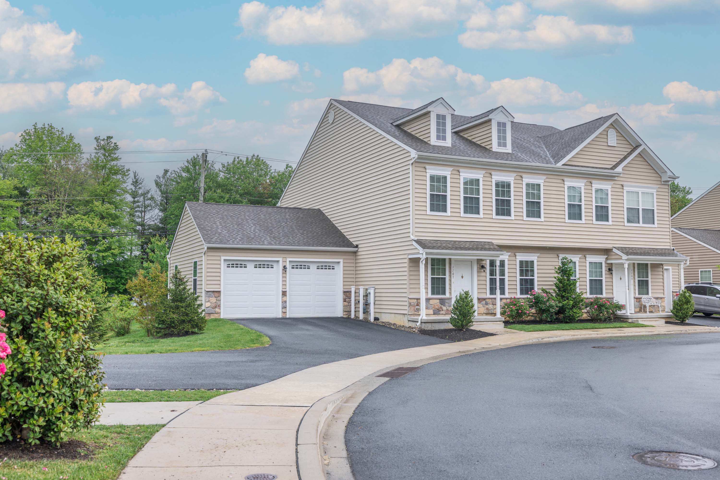 a large house with a street in front of it