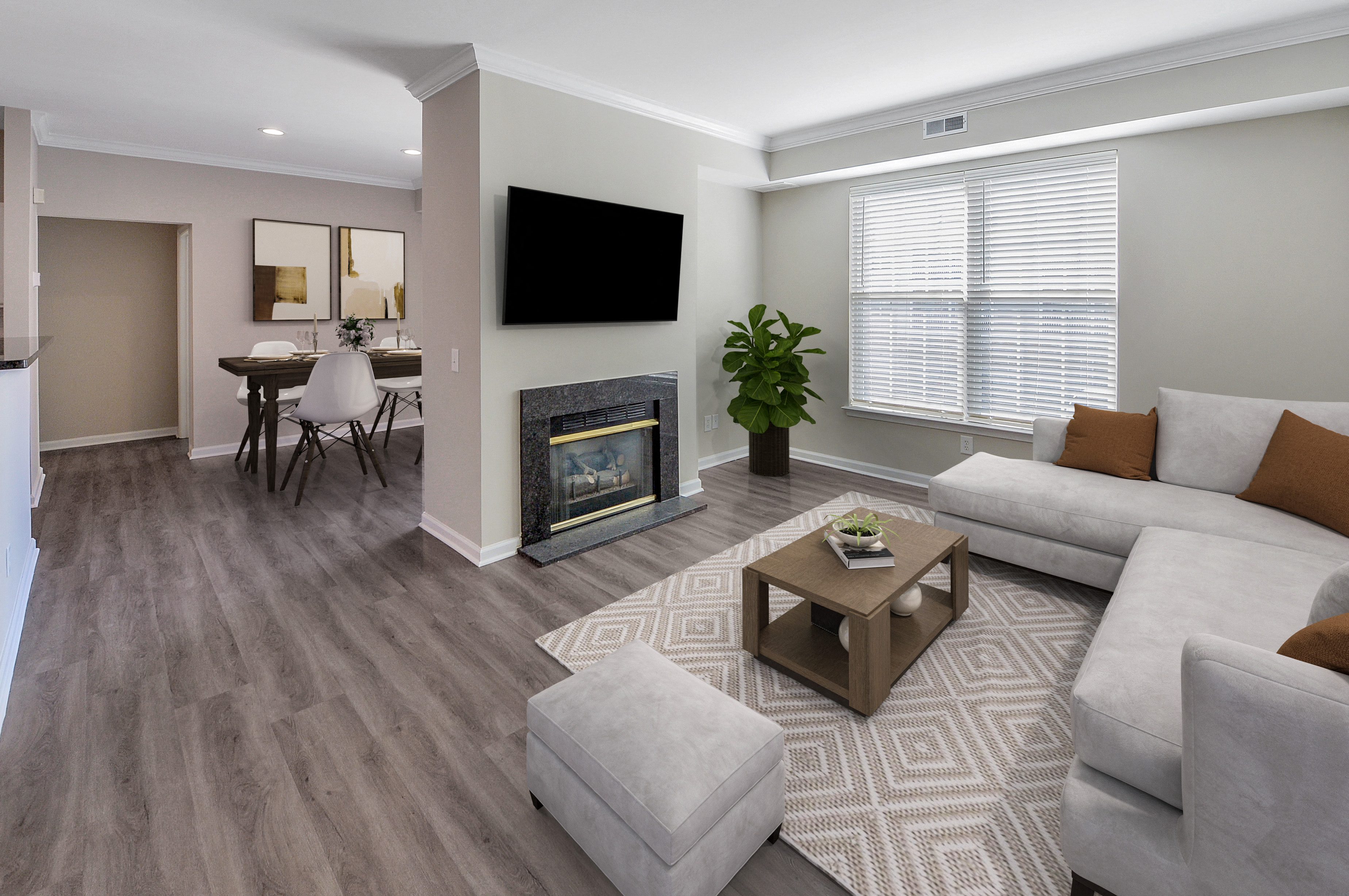 a living room with a fireplace and a couch and a table