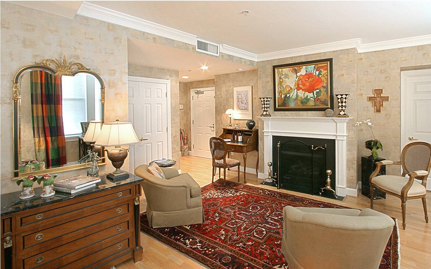 a living room filled with furniture and a fire place