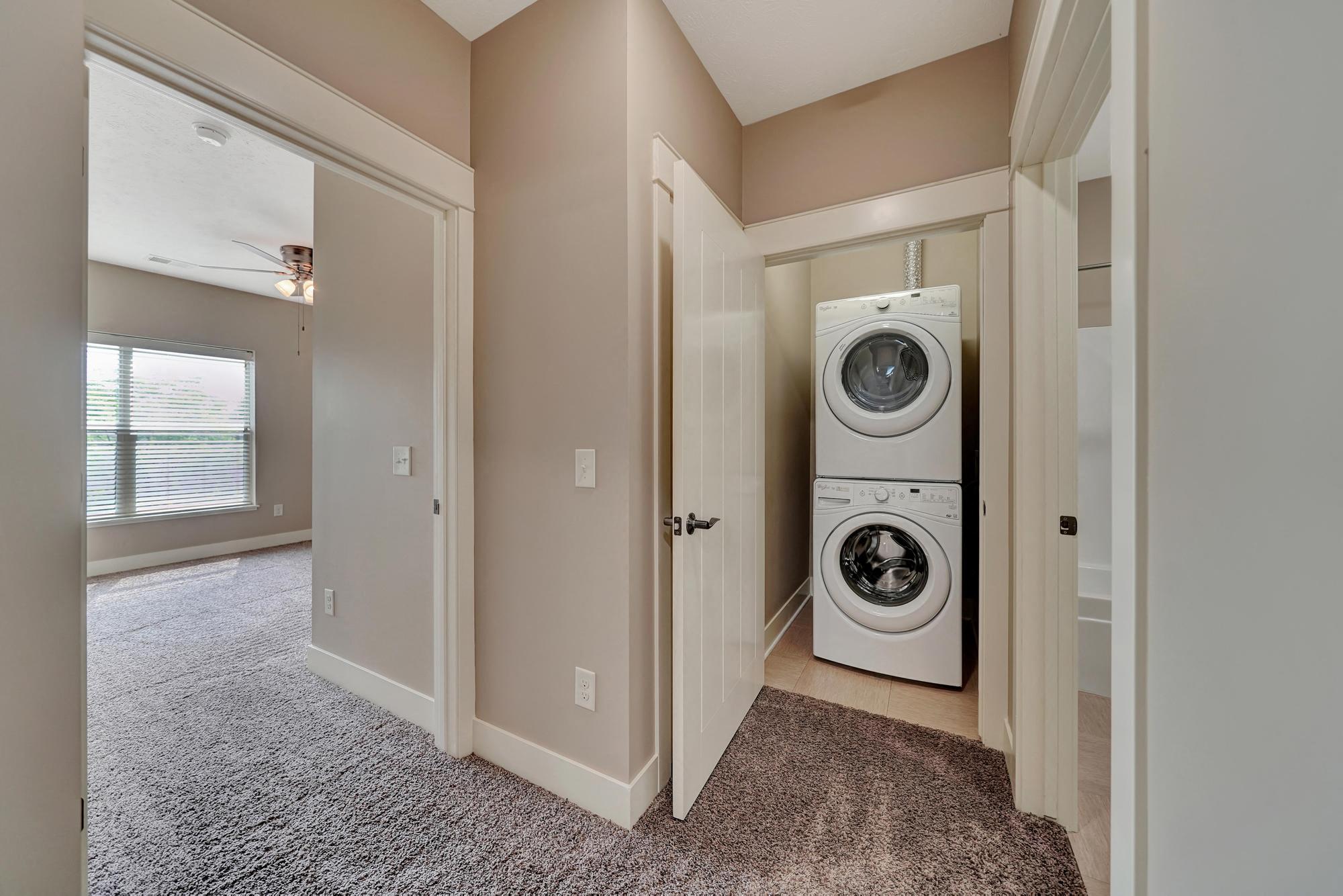 a laundry room with a washer and dryer in it