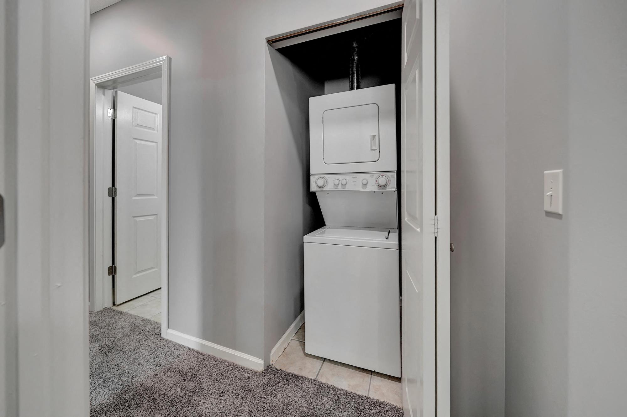 a laundry room with a washer and dryer in it